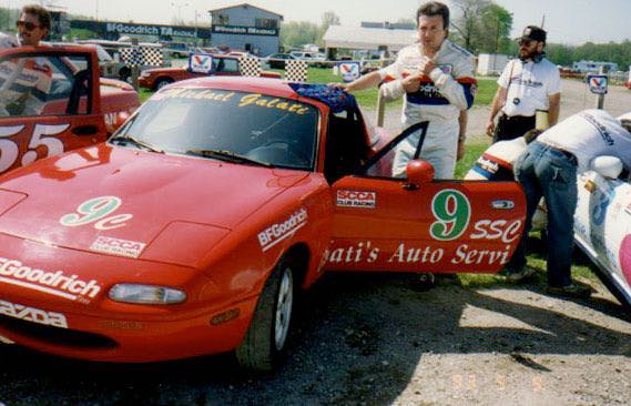 Michael Galati beside a red Galati's Auto Service race car