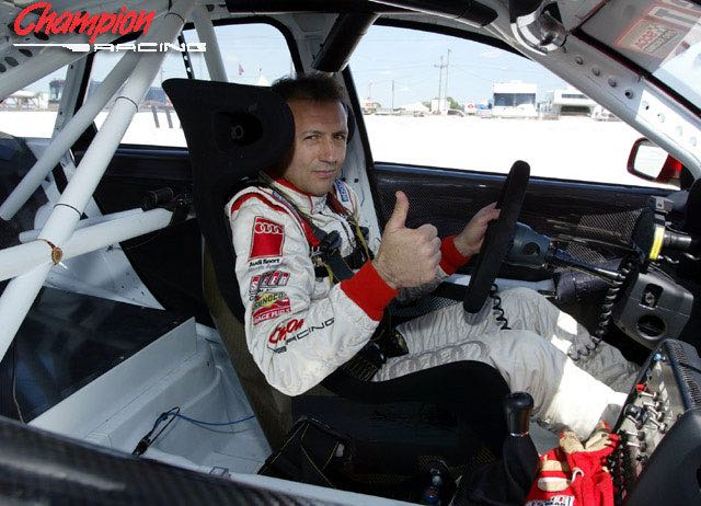 Michael Galati giving a thumbs-up from inside a prepared race car